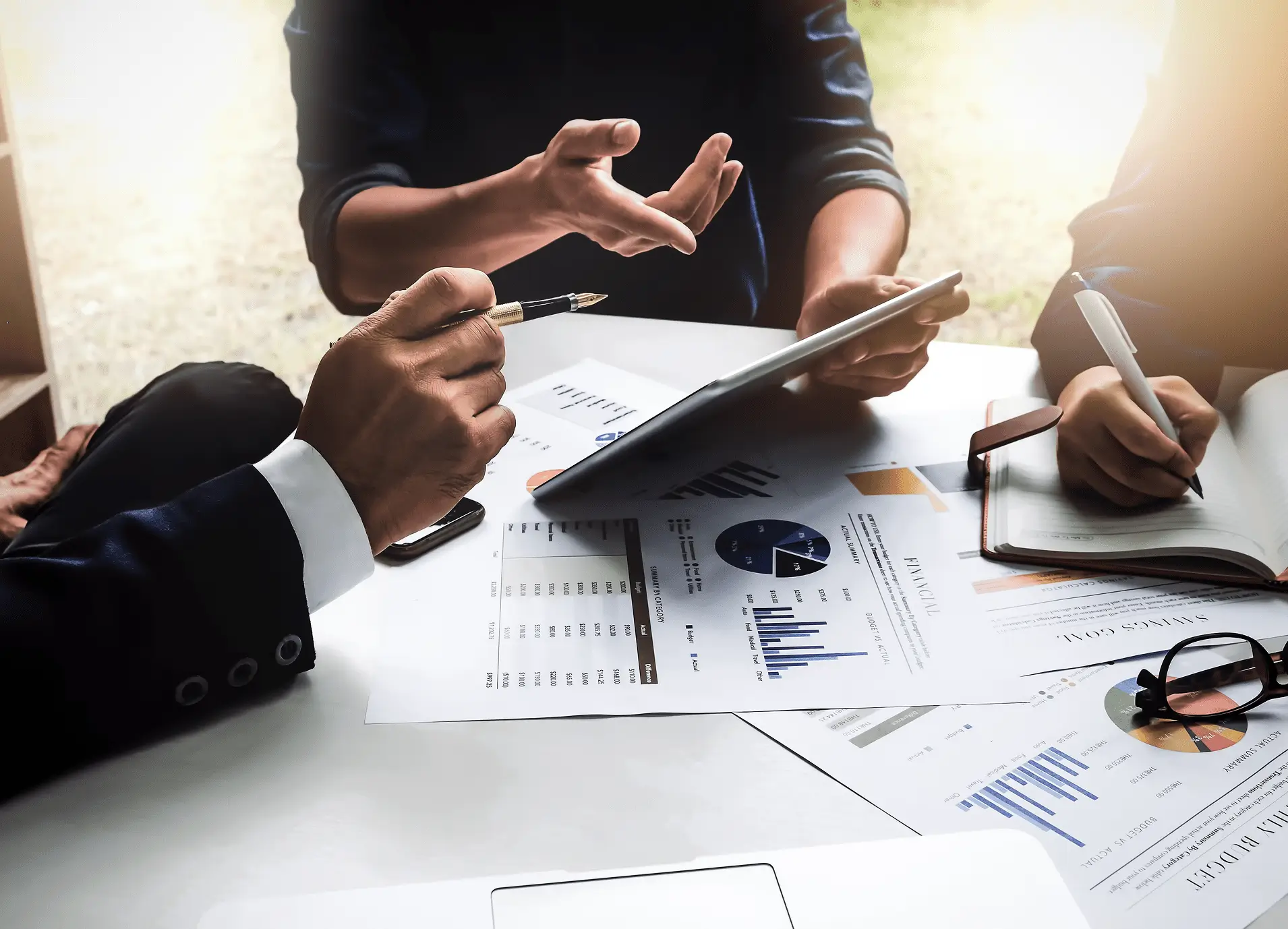 Analyzing financial graphs during discussion in a room